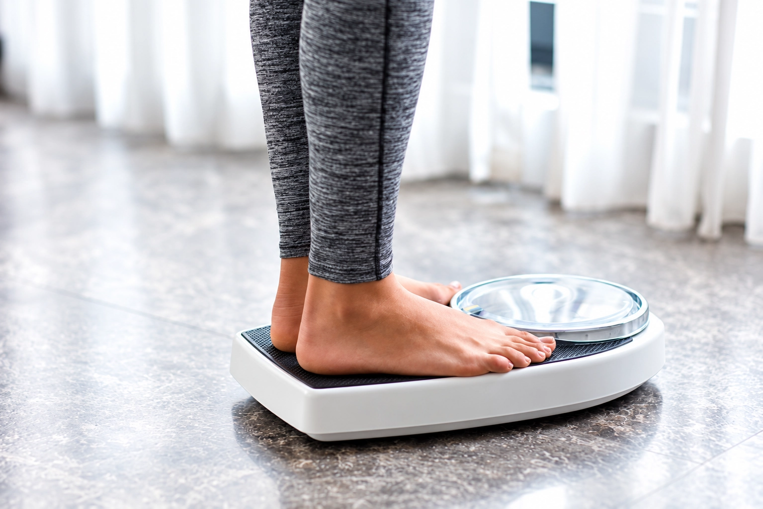 Person standing on a digital weighing scale
